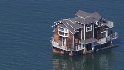 Houseboat floats through San Francisco Bay