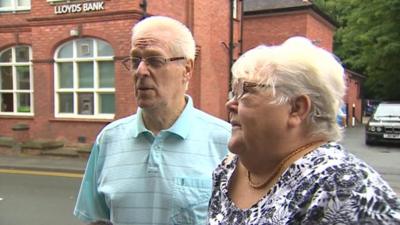 Couple outside Lloyds Bank in Hawarden