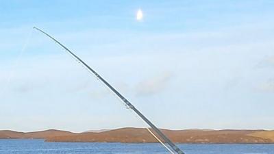 An angler filmed the bright light streaking across the sky during a fishing trip in the Western Isles.