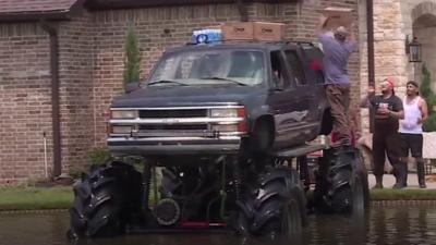 A monster truck driver helps with relief efforts for Hurricane Harvey victims