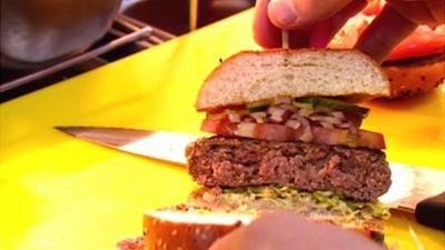 Chef shows off a burger