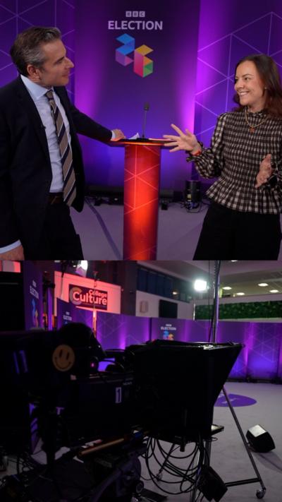 A man and woman are seen speaking against a purple backdrop