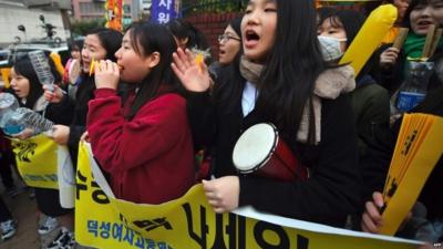 Students cheer in support for those sitting the test