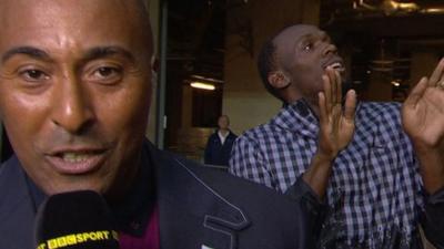 Usain Bolt busts some moves behind Colin Jackson