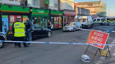 A cordon is put in place and armed officers deployed to a seaside town.