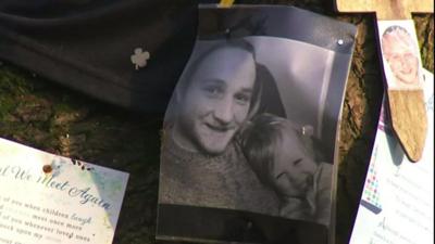 Photograph of Andy Roberts with his young daughter