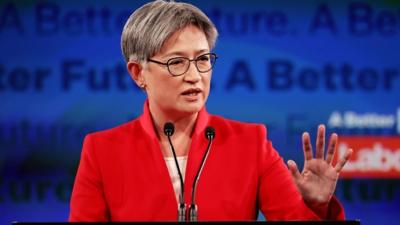 Penny Wong speaks at podium