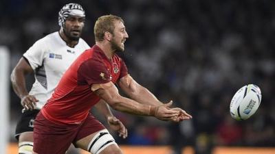 England's flanker and captain Chris Robshaw passes the ball during the opening game of the Rugby World Cup against Fiji