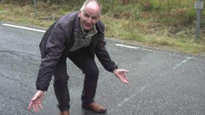 A faint line in the road marking the Norway-Sweden border