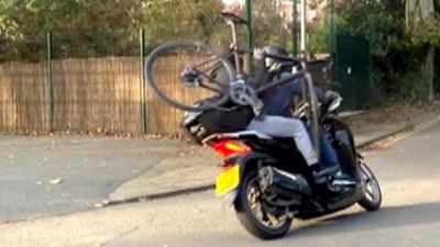 Thieves on moped with a stolen bike