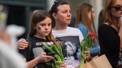 People pay their respects to Manchester attack victims