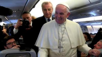 Pope Francis on board the papal plane