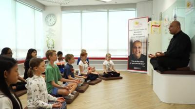 Children studying meditation