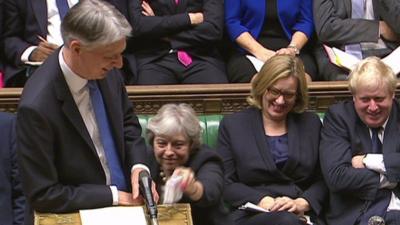 PM hands cough sweets to the chancellor