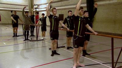 Rugby team doing ballet