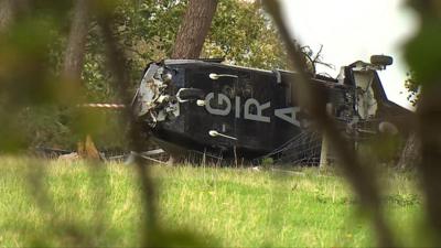 crashed helicopter body in a forest