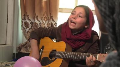 Mursal at the Kabul guitar school run by US musician Lanny Cordola