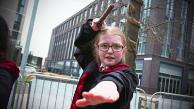 girl waving a wand