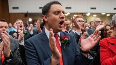 Scottish Labour leader Anas Sarwar celebrates Labour's Michael Shanks win