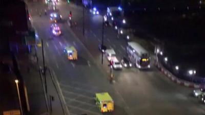 Footage posted on Twitter by Sam Coley shows a string of emergency services vehicles heading to the Manchester Arena after reports of an explosion.