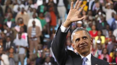 Barack Obama waving to the crowds after speaking at an indoor stadium in Nairobi on Sunday