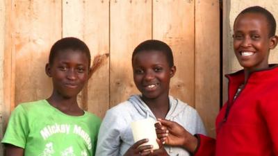 Three boys smiling