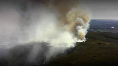 plume rises abover moor