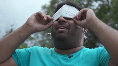 BBC Click's Omar Mehtab puts a face mask over his eyes