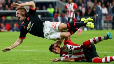 Luke Shaw tackled by Hector Moreno