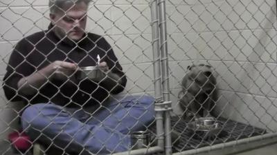 Dr Mathis and Graycie in the cage