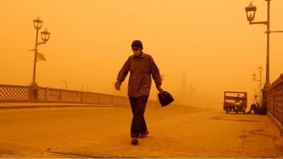 Man walking on bridge