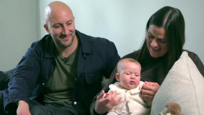 Parents Nabil (L), Lucy (R) and baby Dina (C)