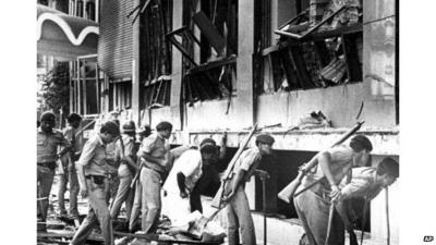 File photo from 1993 - officers search for survivors in wreckage of Bombay Stock Exchange in Mumbai, India