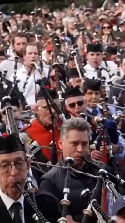 Hundreds of bagpipers perform AC/DC hit