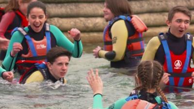 School pupils learning how to stay safe around water.