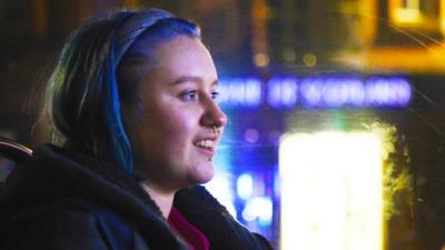 Woman playing video game at festival