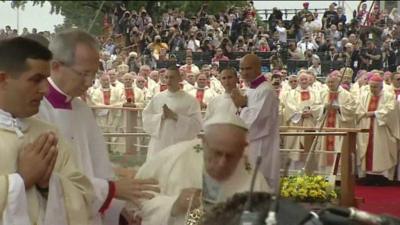 Pope Francis falls over as he arrives to celebrate Mass at Czestochowa in Poland