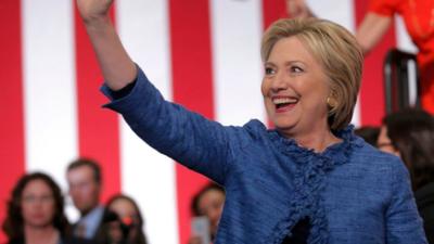 Democratic U.S. presidential candidate Hillary Clinton waves as she arrives to speak to supporters at a campaign rally in West Palm Beach, Florida March 15, 2016.