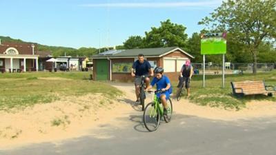 People riding bicycles