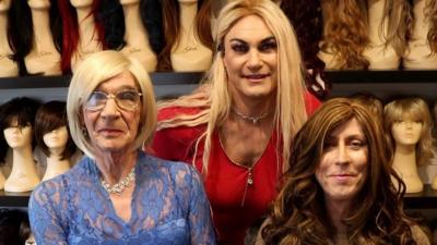 Transgender women trying on wigs