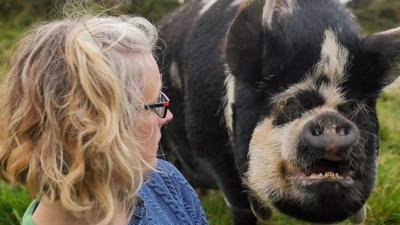 Alexis and one of her rescued pigs