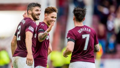 Hearts' Sam Nicholson (centre) celebrates having scored his side's third of the match