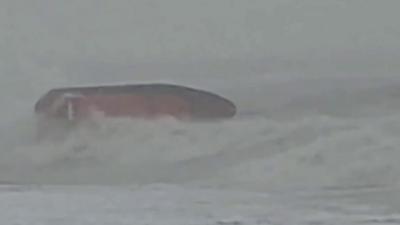 Hastings lifeboat nearly capsizes