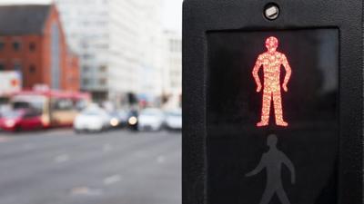 A red man at a pedestrian crossing