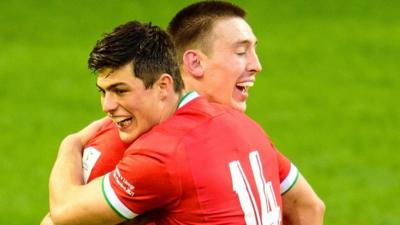 Louis Rees-Zammit and Josh Adams celebrate