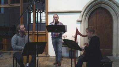 Musicians performing medieval carol