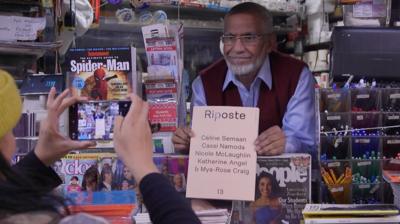 Mohammed holding a magazine