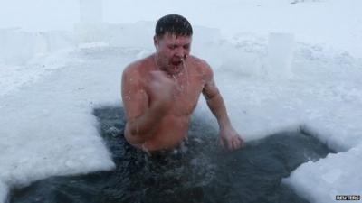 Man in icy water