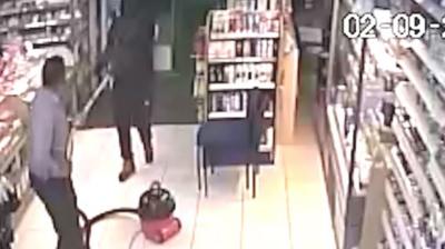 Shop cleaner fends off robber with hoover