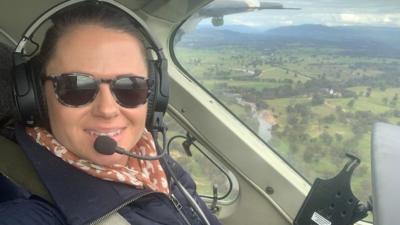 Selfie of woman flying light plane